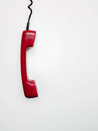 Red retro handset on white background. Isolatedの写真素材