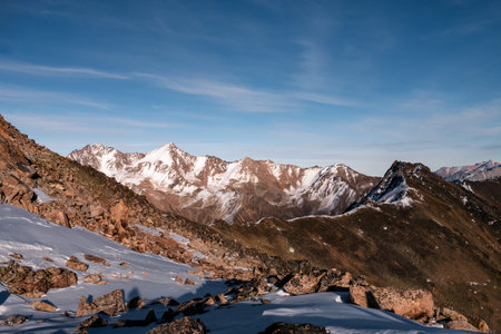 Snowy Greater Caucasus ridge. Sunny day. Before suset. View from 3500m