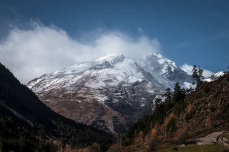 Beautiful view of Mountain Cheget with cloud. Greater Caucasus Range. Elbrus regionの写真素材