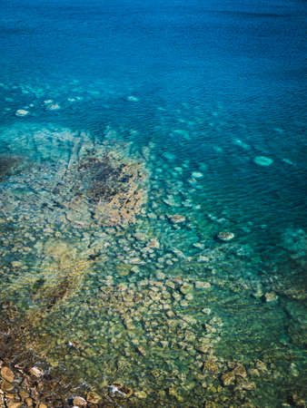 Sea surface with small waves, top view in blue and turquoise color tones. Ecology concept.の写真素材