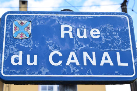 Road sign with the street name Rue Du Canalの写真素材