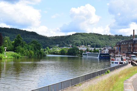View of the river Saar with a cruise ship in Mettlachのeditorial素材