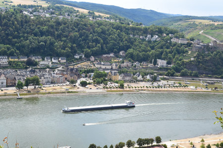 View of the river Rhine  with a cargo ship passing Sankt Goar