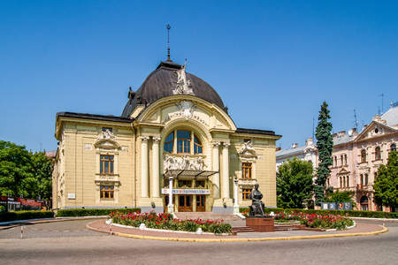 Chernivtsi city. Ukraine. Chernivtsi Music and Drama Theater. Summer 2015. Sculptures and flowers near  theater houseのeditorial素材