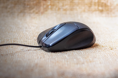 Black computer mouse for easy work on a computerの写真素材