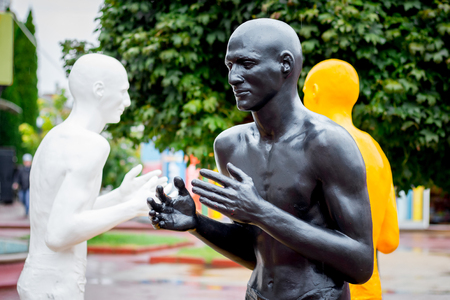 Ukraine. Khmelnytskyi. October 2018. Sculptures by Viktor Sidorenko. The dialogue of representatives of different races. Understanding between people with different skin colorsのeditorial素材