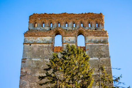 Tower of a medieval castle against a blue sky background