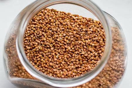 Grain of buckwheat in a glass jar, top viewの写真素材