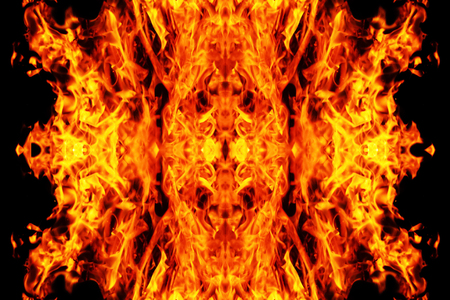 Abstract bright geometric ornament with red elements on a black background consisting of tongues of fireの写真素材