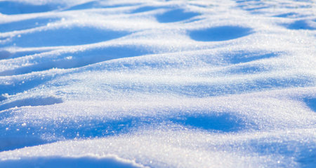 The texture of snow on a clear sunny winter day