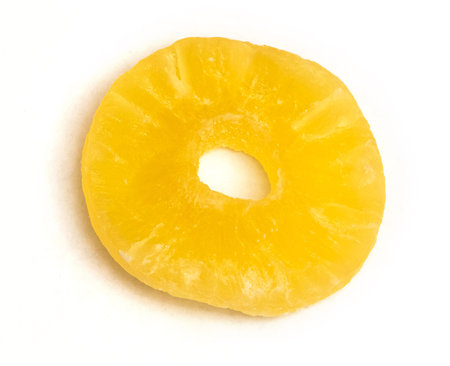 Slice of dried pineapple on a white isolated backgroundの写真素材