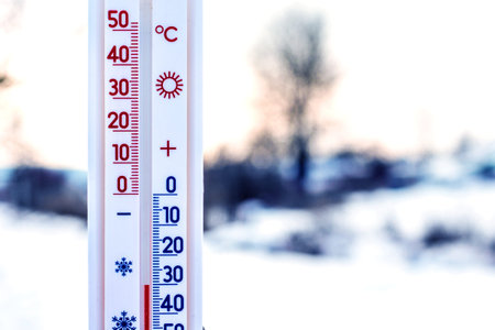 The thermometer shows 30 degrees of frost. Thermometer in the background of the winter landscape....