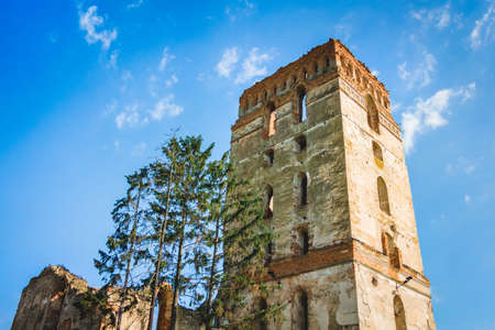 Tower of an ancient medieval castle against a background of blue skyの写真素材