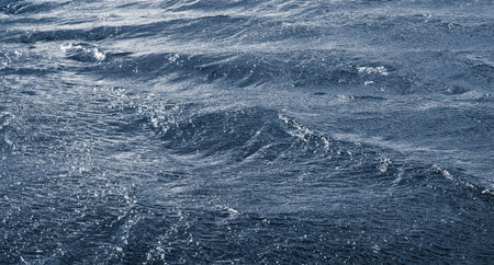 Waves on the river during a strong wind. Water texture
