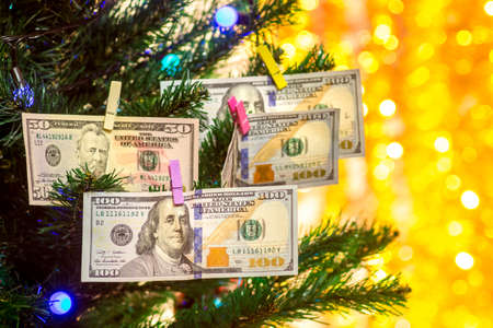 Christmas tree decorated with dollar bills. Wishes Wealth in the New Yearの写真素材