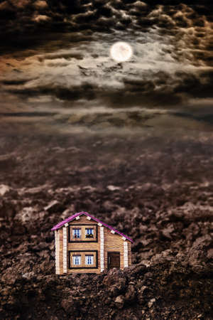 Lonely house in a field in the moonlit night. Life outside of civilization. Development of new lands. The first new buildingの写真素材