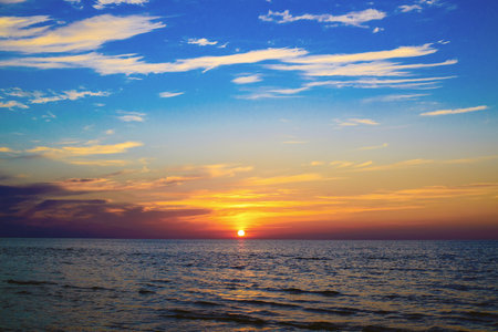Sunset at Sea, cloudy sky, dusk, Maltaの写真素材