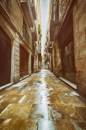 Straight narrow street in Gothic quarter, Barcelona. Vintage styleのeditorial素材