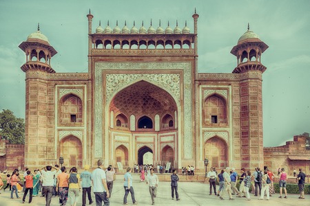 Agra, India - October 29, 2014: The people walking in front of main gate of Taj Mahal. One of the biggest tourist destinations in India.のeditorial素材