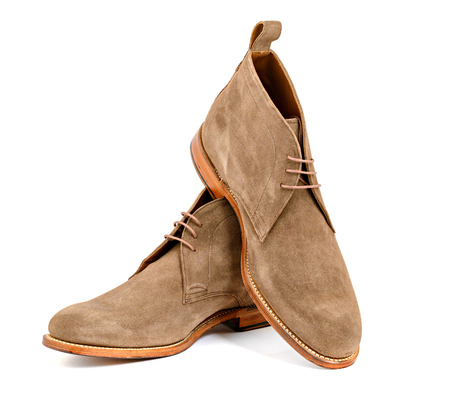 Mens almond suede boots isolatedの写真素材
