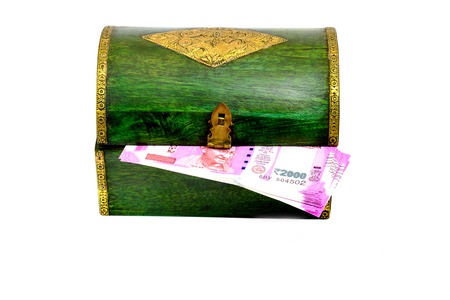 Vintage wooden casket from India with rupees notesの写真素材