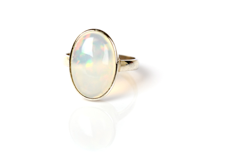 Opal Ring in silver iridescent on white backgroundの写真素材