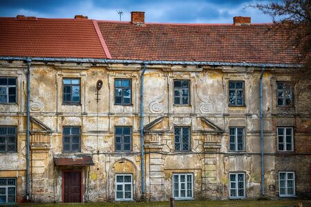 Old vintage building in Vilnius with red bricks roofの写真素材