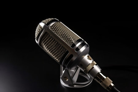 Studio audio microphone, with black background. High quality generative AIの素材