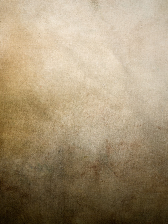 Warm rich tan vintage canvas background with stains and pigments gradation to creamの写真素材