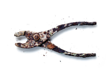Graphic, warm toned, rusty corroded pliers on isolated on white backgroundの写真素材