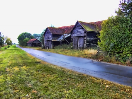 Old barn beside roadの写真素材