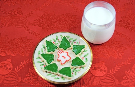 Christmas Cookies and Milk on Red Placematの写真素材