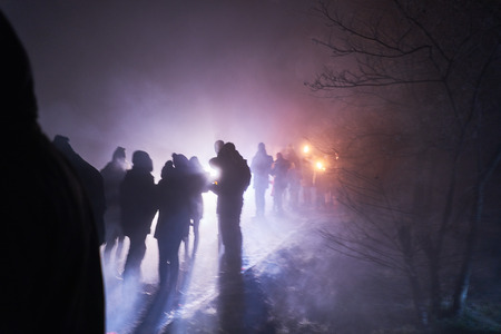 people standing and watching fireworks, silvester, dark, silhouetteの写真素材