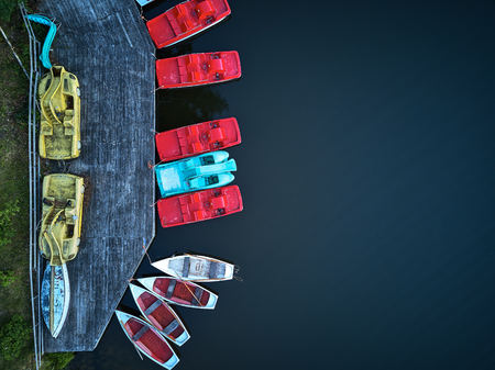 pedal boats shot from top, above in structure and redの写真素材