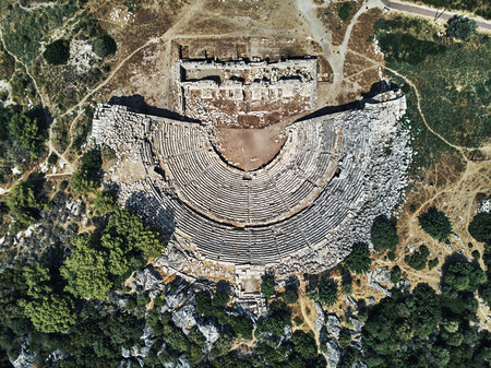 top drone view of the Historic open-air theater in the ancient city of Patara. aerial shot of...
