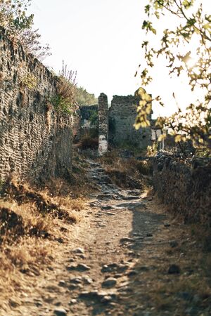 The abandoned Greek village of Kayakoy, Fethiye, Turkey. Ghost Town Kayakoy. Turkey, evening sun. Ancient abandoned buildings of rock and stone.の写真素材
