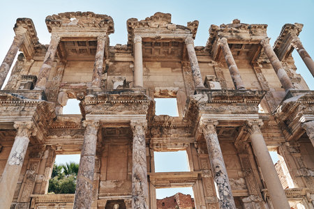 The ruins of Celsus Library in Ephesus at sunny evening sun. Beautiful light of the old ancient...