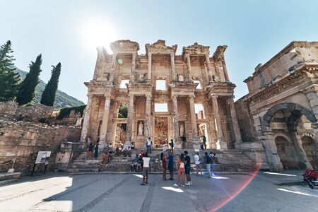 The ruins of Celsus Library in Ephesus at sunny evening sun. Beautiful light of the old ancient rocks and stones, turkeyの写真素材
