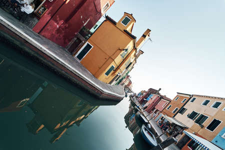Bright colorful houses and buildings in Burano - streets of veniceの写真素材