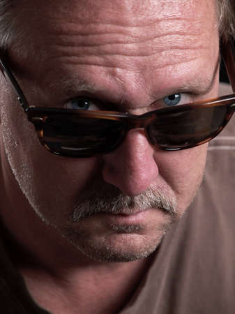 The photo shows a portrait of a mid adult manの写真素材