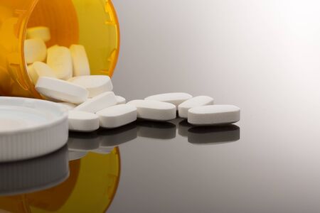spilled out on table for health addiction pain medicineの写真素材