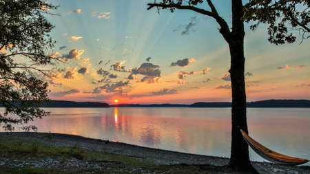 Beautiful sunrise over lake Ouachita near Hot Springs Arkansasの写真素材