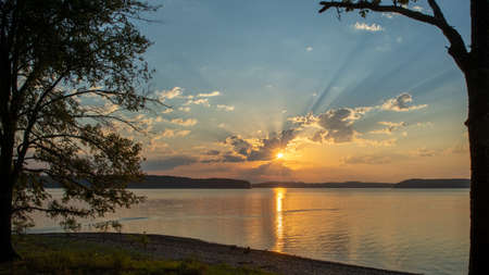 Beautiful sunrise over lake Ouachita near Hot Springs Arkansasの写真素材