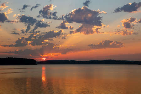 Beautiful sunrise over lake Ouachita near Hot Springs Arkansasの写真素材