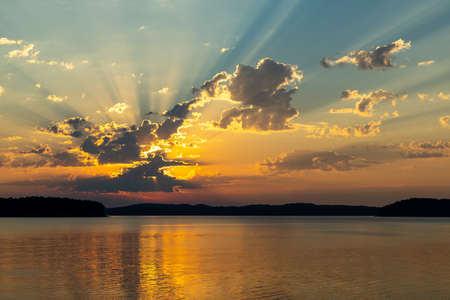 Beautiful sunrise over lake Ouachita near Hot Springs Arkansasの写真素材