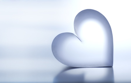 Heart shaped by a piece of paper. Folded and one piece of tape used.の写真素材