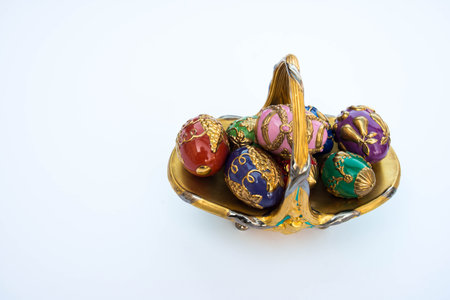 Colorful fancy jeweled easter eggs in basket