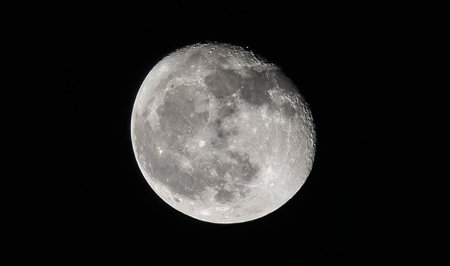 October moon in the dark sky