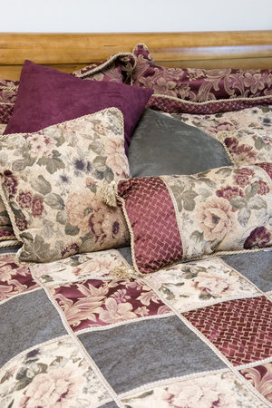 comforter and pillows on brand new bed