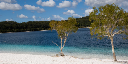 Lake McKenzie is an amazing clear lake on fraser island with super white sandの写真素材